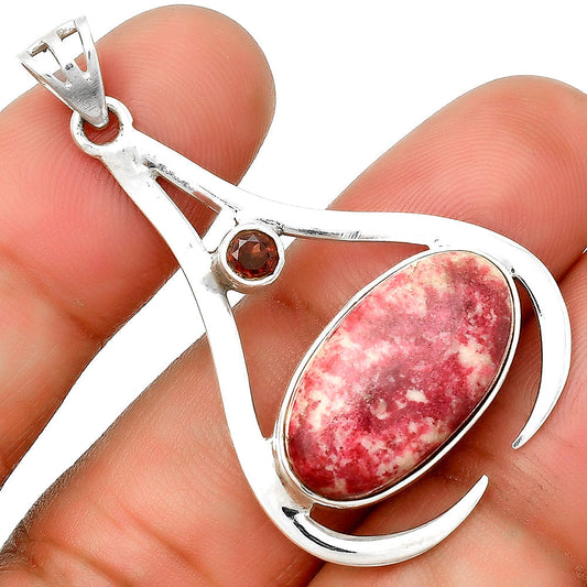 Silver pendant with pink thulite teardrop and small red garnet accent